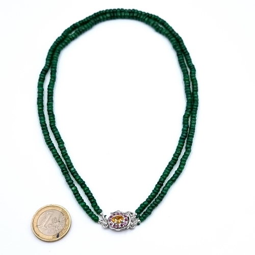 28 - Star Lot : A beautiful graduated Emerald cabochon twin strand necklace, set with Citrine and Ruby st... 