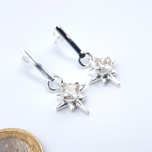 29 - A pretty pair  earrings, set with beautiful princess cut Moissanite stones of 2 carats and set in st... 