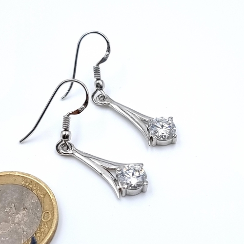 30 - A very pretty pair of earrings, set with beautiful round  cut Moissanite stones of 2.4 carats and se... 