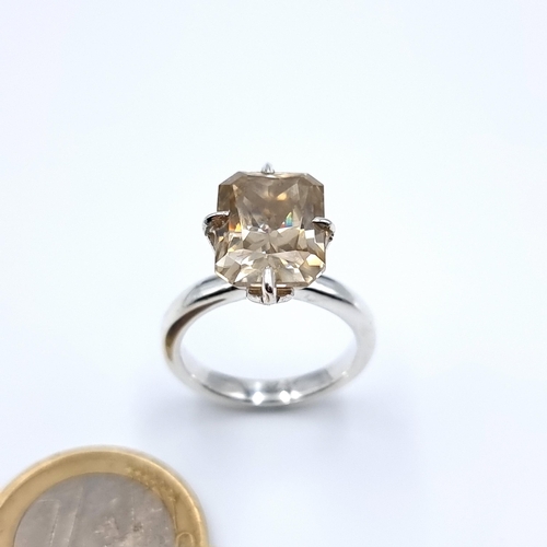 33 - A radiant cut Champagne Moissanite stone ring. A generous size stone in this example, with 8.9 carat... 