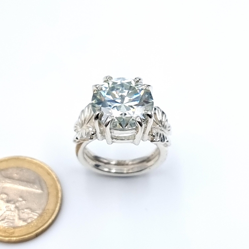 4 - A strikingly huge 17 carat cushion cut blue Moissanite ring, set in sterling silver. An impressive p... 