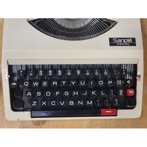 346 - A Mid Century Sanplé 280DL typewriter in shades of cream and black. In original case. Very clean exa... 