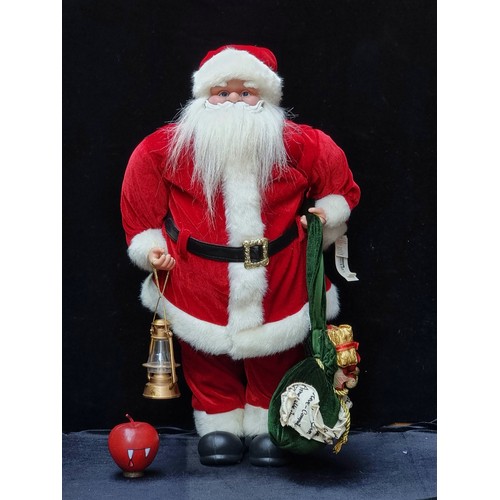 430 - A freestanding, traditional style Santa Claus figure. Dressed in the customary plush red leather wit... 