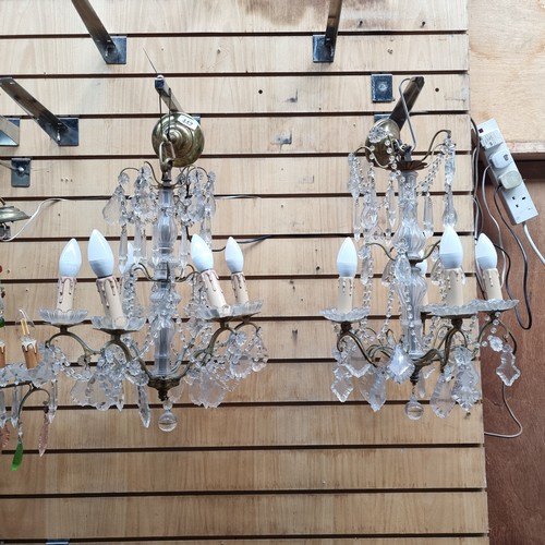 442 - Star Lot : A beautiful pair of vintage cut crystal, six-branched chandeliers. With an abundance of f... 