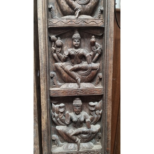 312 - Star lot : A pair of early 20th Century, Indian, hand-carved oak panels depicting Hindu iconography ... 