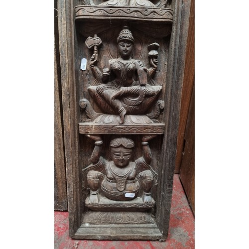 312 - Star lot : A pair of early 20th Century, Indian, hand-carved oak panels depicting Hindu iconography ... 