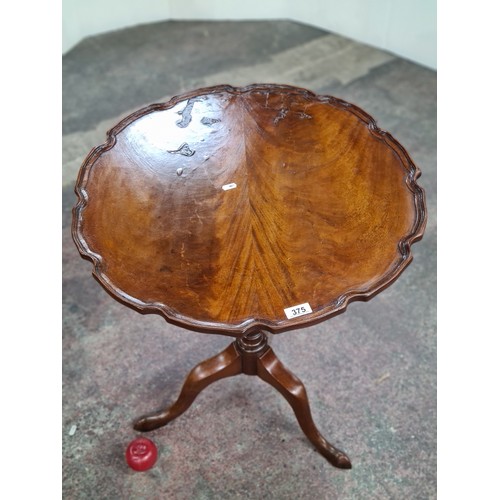 375 - Star lot : A beautiful Victorian piecrust folding occasional table with a turned base on three legs.