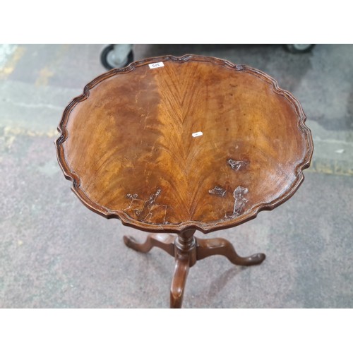 375 - Star lot : A beautiful Victorian piecrust folding occasional table with a turned base on three legs.