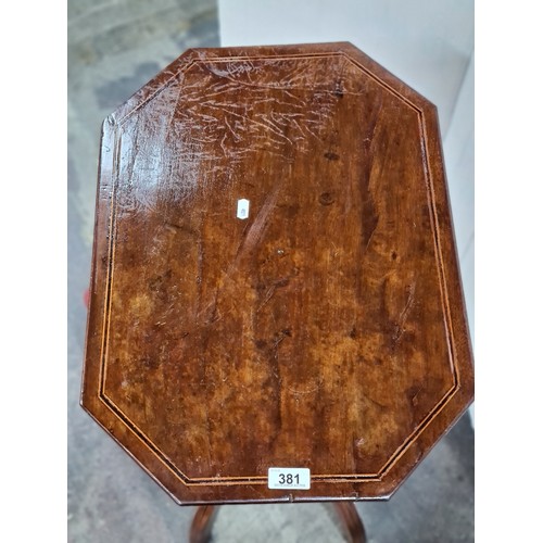 381 - A charming Edwardian wine table with an octagonal top, quadroped base and string inlay. This his a l... 