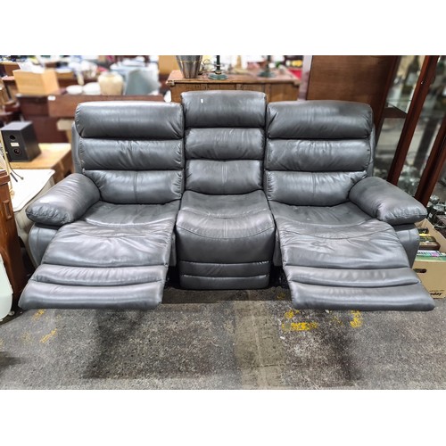 604 - Star Lot : A large contemporary three-seater sofa. Upholstered in Italy in a slate grey leather and ... 