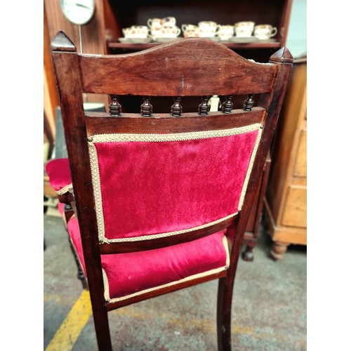 561 - A large lovely Victorian armchair with profusely turned front legs and carved backrest. With upholst... 