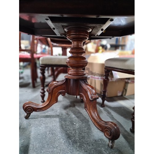 635 - Star lot : A beautiful Victorian dining set with a round table with carved tripod pillar base held o... 