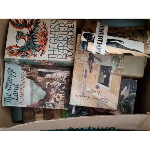 714 - A collection of five boxes filled with books, including vintage hardcover books such as 