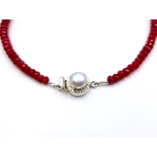 8 - A fine example of a single strand graduated African Ruby necklace, featuring a generous 250 carats a... 