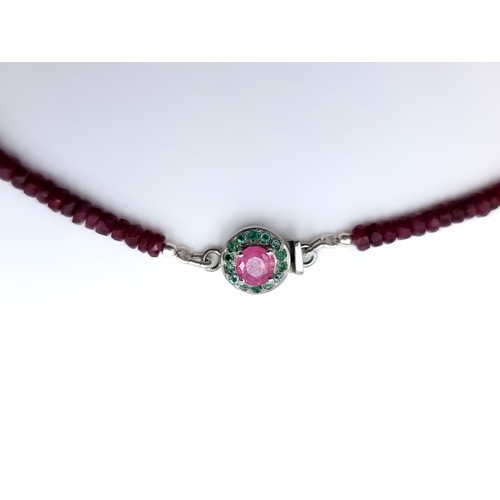 21 - A fine example of a single strand graduated untreated Ruby necklace, of 110 carats and featuring a n... 