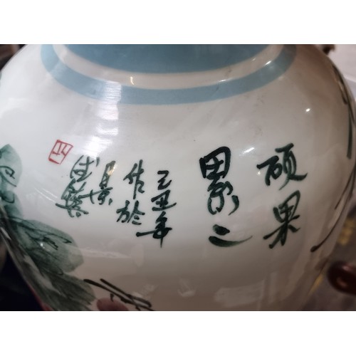 710 - Star lot : A huge Chinese urn vase with hand painted floral and koi motif. In super condition. 
MM: ... 