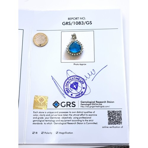 765 - Star Lot : A fabulous huge 11cts Ocean blue natural Topaz, Surrounded by beautiful bright diamonds o... 