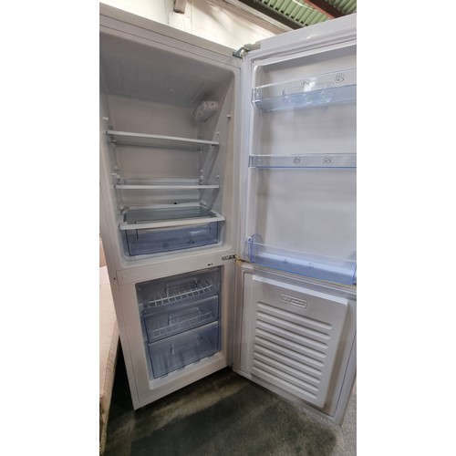 384 - A Lec fridge freezer model no. W1510158 in a white finish, with plenty of storage inside.