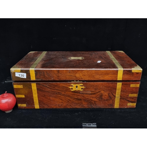 130 - A very attractive Victorian rosewood, brass bound writing slope. The box opens to reveal an attracti... 