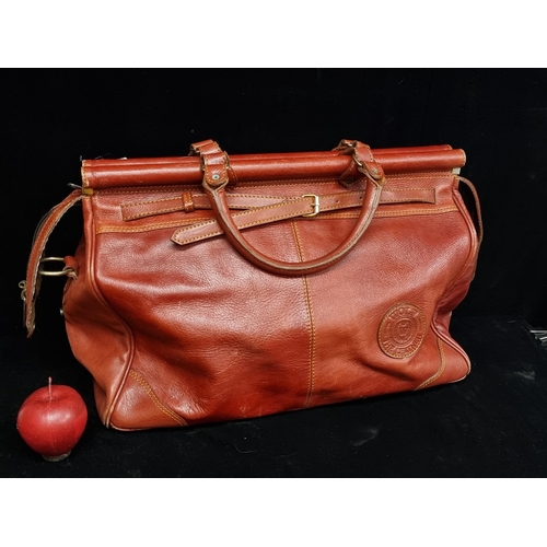 Sold at Auction: An oxblood leather Gladstone bag