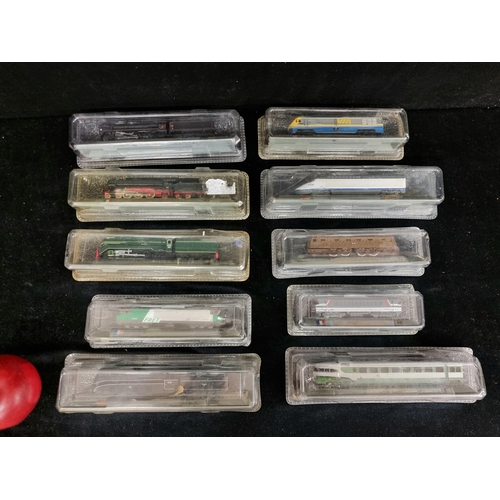 176 - A selection of ten, collectable model trains and carriage cars by Del Prado. In original packaging. ... 