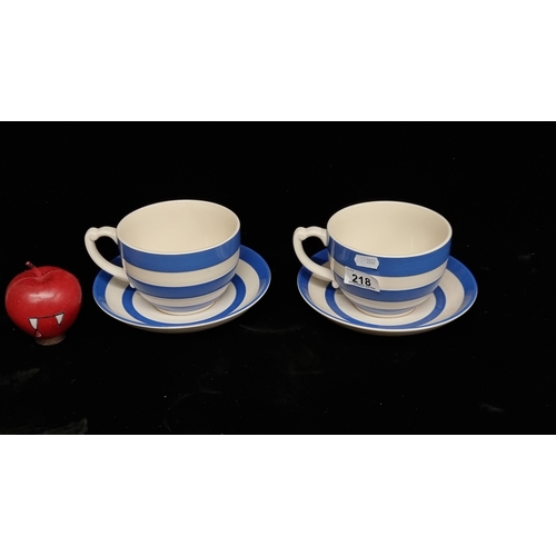 218 - Four pieces of Cloverleaf Pottery in the classic stripe pattern. Includes two huge oversized tea cup... 