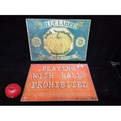 245 - Two cast metal signs including one for ''Blue Label Golden Pumpkin'' and another prohibiting playing... 