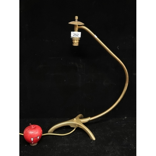 252 - A very cool vintage 1970s brass desk lamp with a curved stem and bird claw base.
