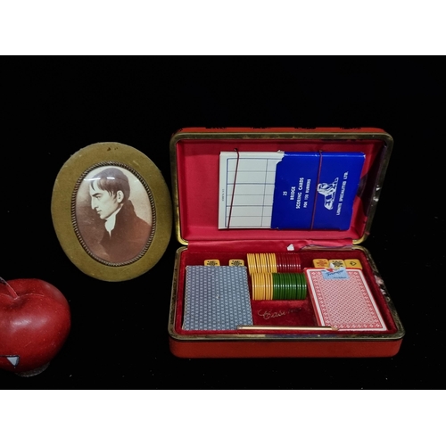 263 - A vintage games compadium including bridge, dice and counters. Along with an antique miniature frame... 