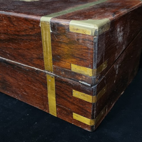 130 - A very attractive Victorian rosewood, brass bound writing slope. The box opens to reveal an attracti... 