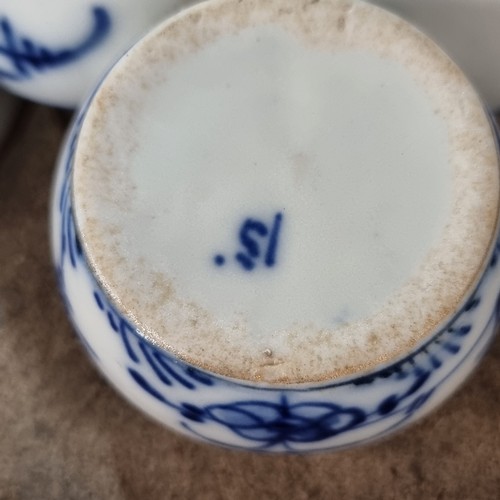 275 - Four pieces of Chinese porcelain including two tea cups, a condiment dish and a saucer, all in blue ... 
