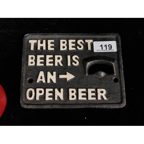 119 - A heavy cast metal wall mountable bottle opener in black, reading 'The Best Beer is an Open Beer'.