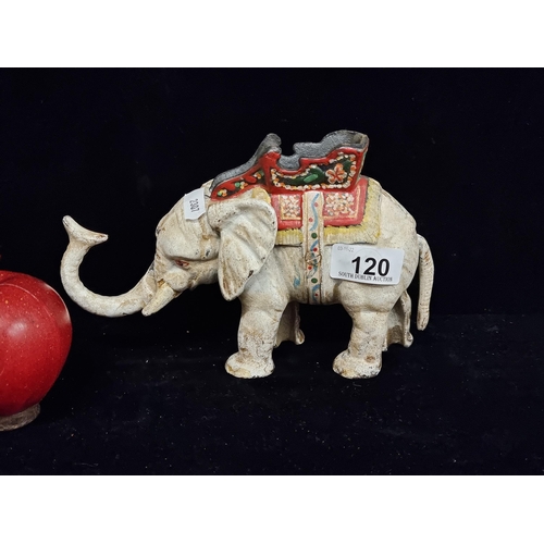 120 - A heavy cast metal money box in the form of an elephant with an articulated trunk and tail. With han... 