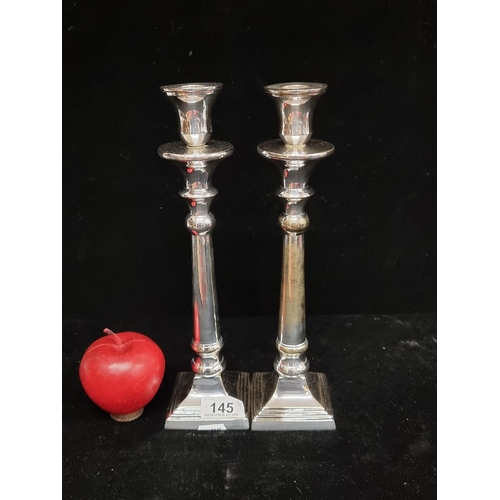 145 - A stunning pair of polished steel candlesticks by Danish brand Lene Bjerre. With a RRP of €90. A bea... 