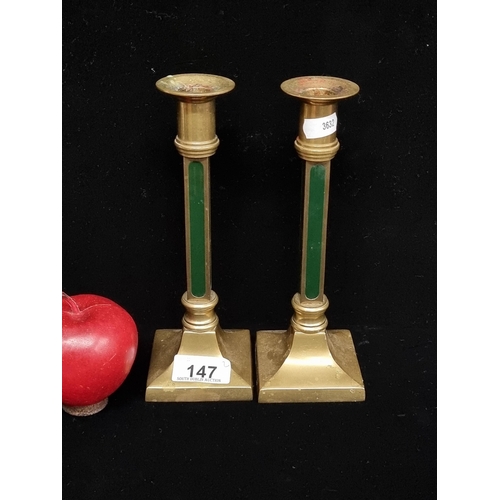 147 - A pair of vintage, heavy brass candlesticks with a rich forest green enamel inlay. A nice pair on a ... 