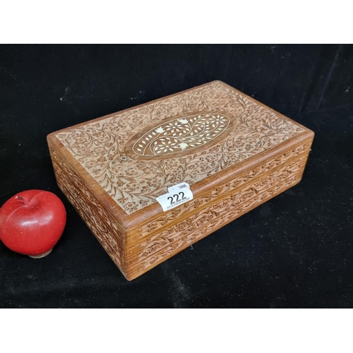 222 - A beautiful hand carved hinged Olive wood lidded box featuring intricate inlay to top and foliate de... 