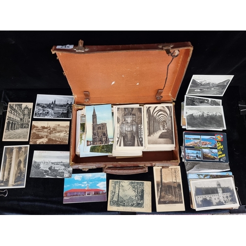 245 - A small leather briefcase filled with German vintage and antique postcards, concerned with European ... 