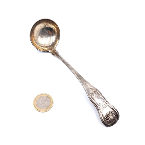 34 - A Georgian-Scottish sterling silver sauce ladle, which features a finely detailed shell finial. Hall... 