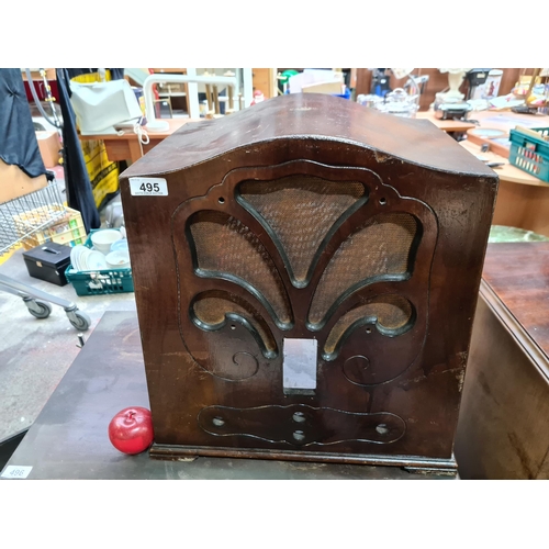 495 - An antique radio wooden case with Art Nouveau style cut outs. A lovely display piece. Just the case ... 