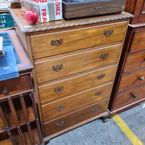 500 - Star Lot. A gorgeous chest of five drawers with swan neck handles. Features rope edging, a gallery b... 