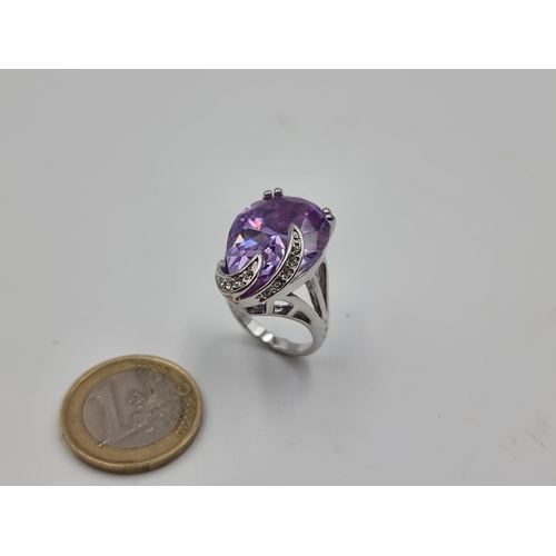 522 - A stunning generous Amythyst ring, with a facet cut to stone and an excellent sparkle. Set in sterli... 