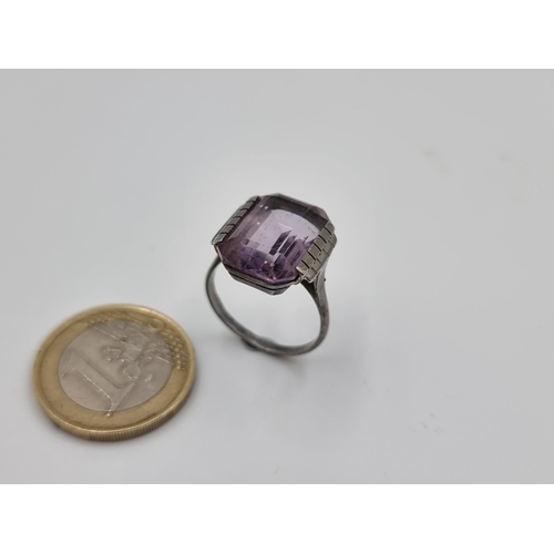 531 - A facet cut stunning Art Deco Amythyst ring, set in sterling silver. Ring size: N. Weight: 4.13 gram... 