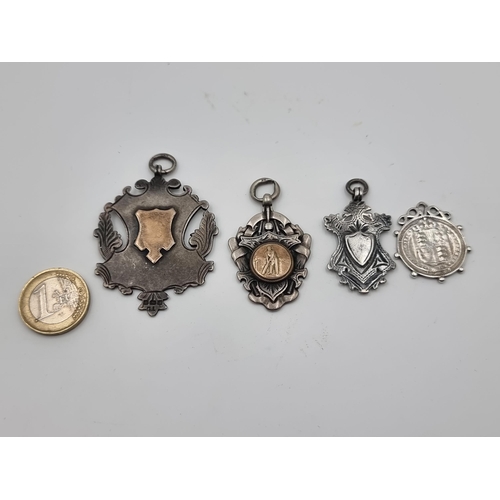 533 - A great collection of four sterling silver medallions, comprising of two 18 Gold inlayed examples. T... 