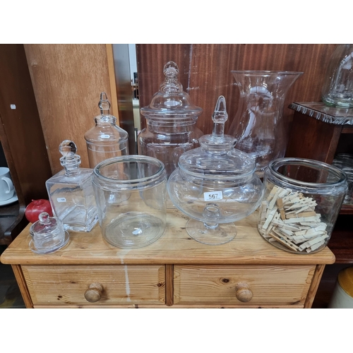 567 - A nice selection of eight ornamental glass jars, comprising of various large examples, a decanter an... 