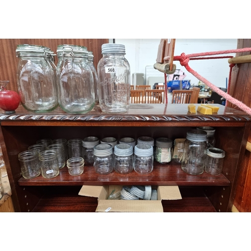 568 - A nice large selection of twenty six canning glass jars in various sizes, including metal and glass ... 