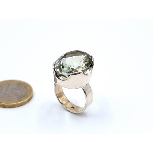 57 - A heavy exquisite and generous Green Amythyst ring, set in thick sterling silver. Ring size: O. Weig... 