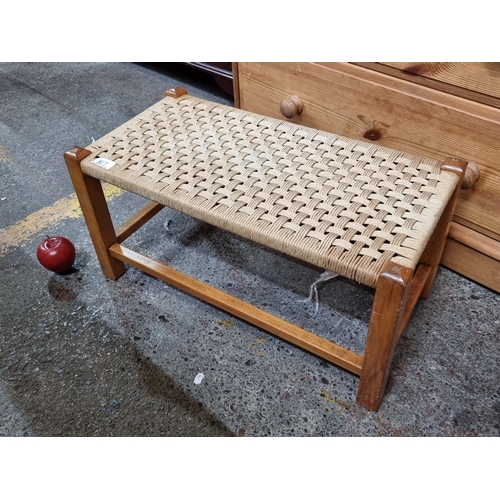 577 - A neatly proportioned rattan foot stool with stretchers. H28cm x W58cm x D29cm