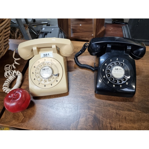 581 - Two vintage P&T Irish made rotary telephones, in cream and black shades.