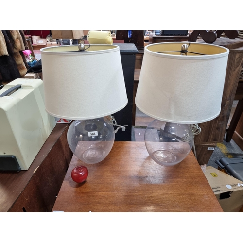 588 - A lovely pair of large contemporary table lamps, with glass bulb shaped bases, chrome fittings and f... 