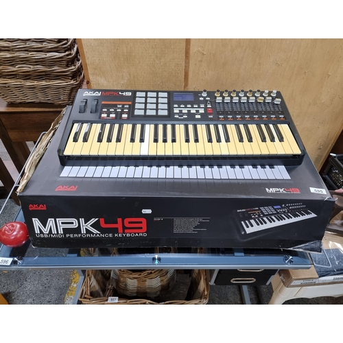 595 - An AKAI Professional MPK49 USB/MIDI Performance Keyboard. With original packaging, this same model i... 